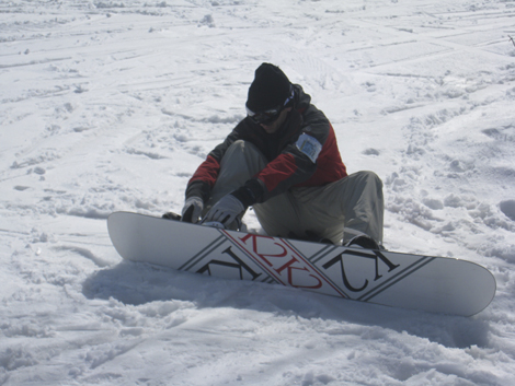snowboarding at Nozawa onsen Strapping in to a K2 162cm rental from Lodge Nagano