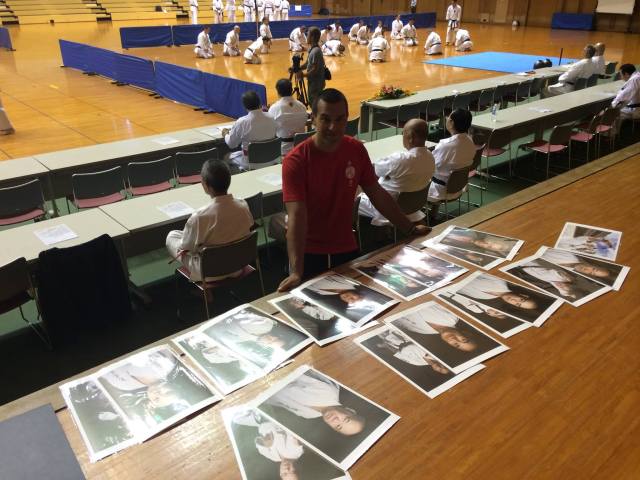 Handing out prints at Naha's budokan.