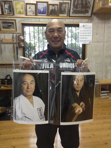 Tokumura shows off the new pictures for his dojo.