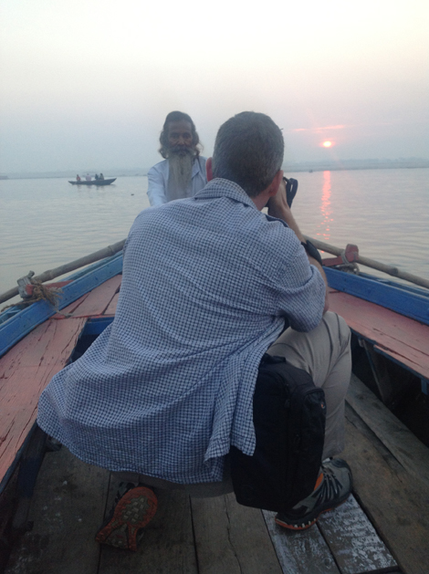 Chris Willson photographing the boatman on the Ganges  - image by Kim Logue