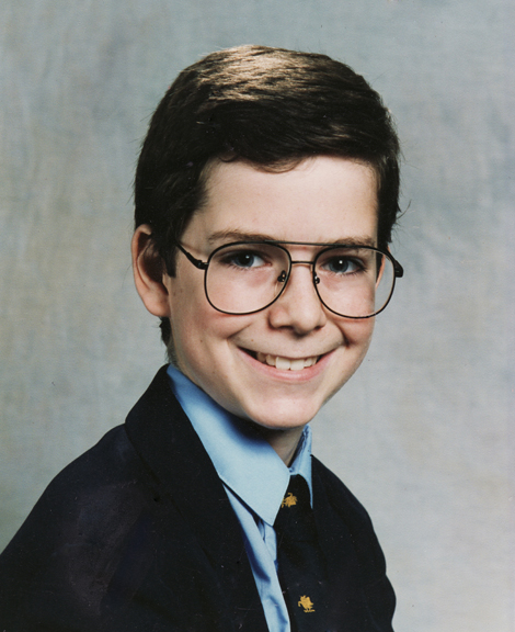 Glasses at age 13, attending The Manchester School of Witchcraft and Wizardry.