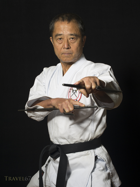 Yukio Kuniyoshi. Kaicho of Ryukyu Kobudo Hozon Shinko Kai. Training on Okinawa, Japan with manji sai