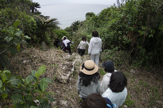 Yuta (priestess) Ayako Toguchi conducts prayers at sea cave called Sururu Gama on the coast of Kouri Island, Okinawa, Japan